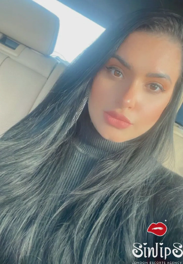 Hatori, brunette busty escort, selfie in a car