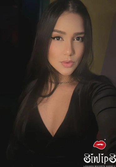 Kalisha, brunette Brazilian escort in black dress